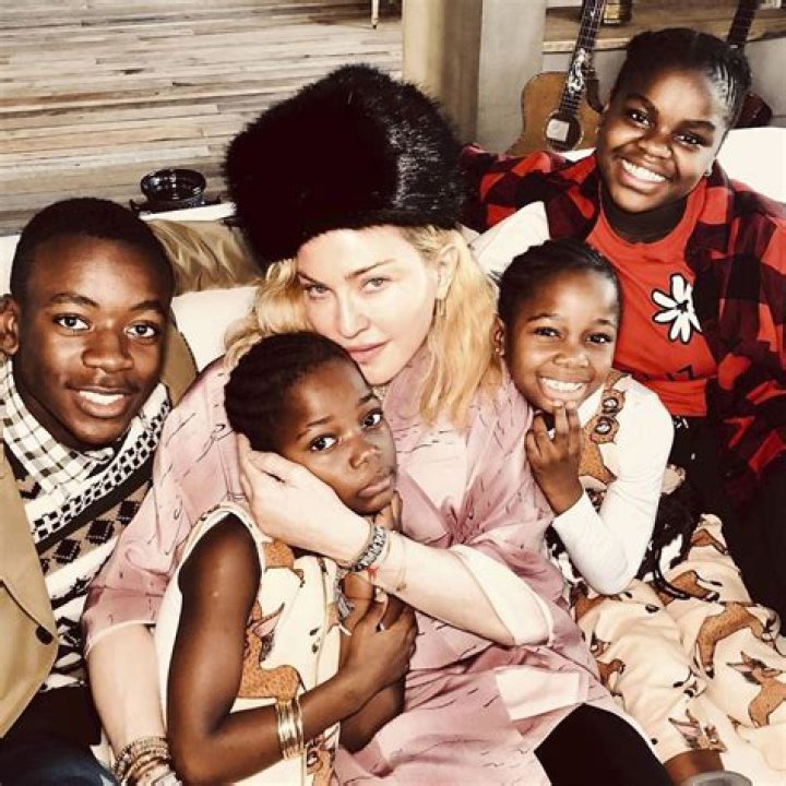 How many biological children does Madonna have? How many children has Madonna adopted?
