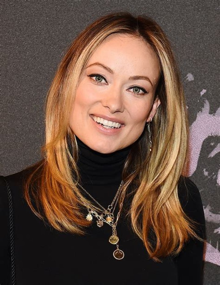 How tall is Olivia Wilde and how much does she weigh?