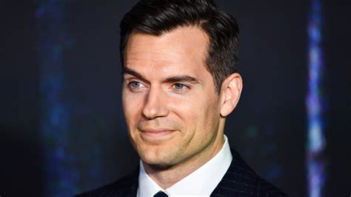 Is Henry Cavill teasing or trolling by lovingly gazing at James Bond’s favored wheels?