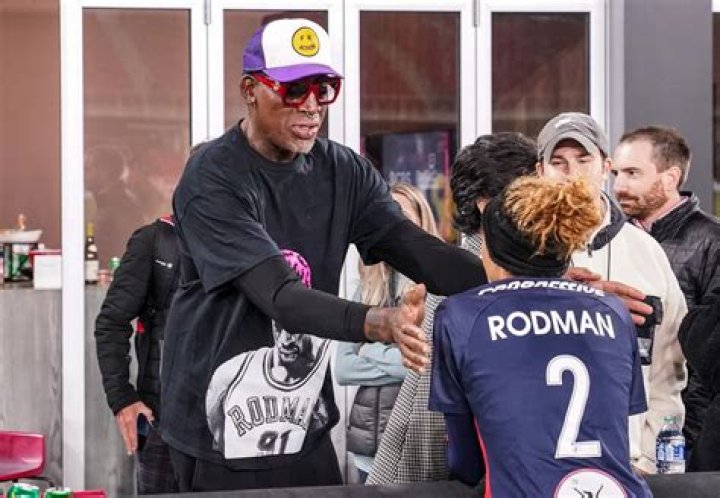 What does Dennis Rodman's father do for a living?